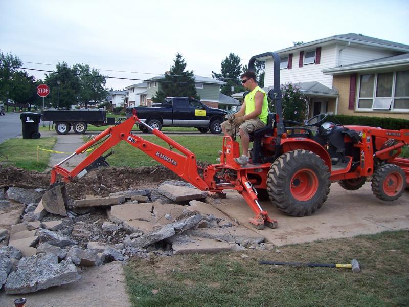 Jon removing an old concrete driveway